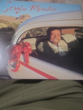 Sergio Mendes Vinyl Record — White Car Cover with Red Accents